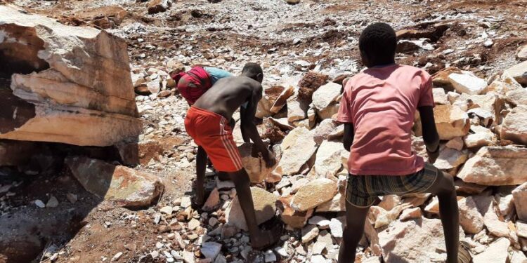 Young boys working at a limestone quarry in Moroto District, Uganda. CREDIT: Joseph Byomuhangyi for ISER