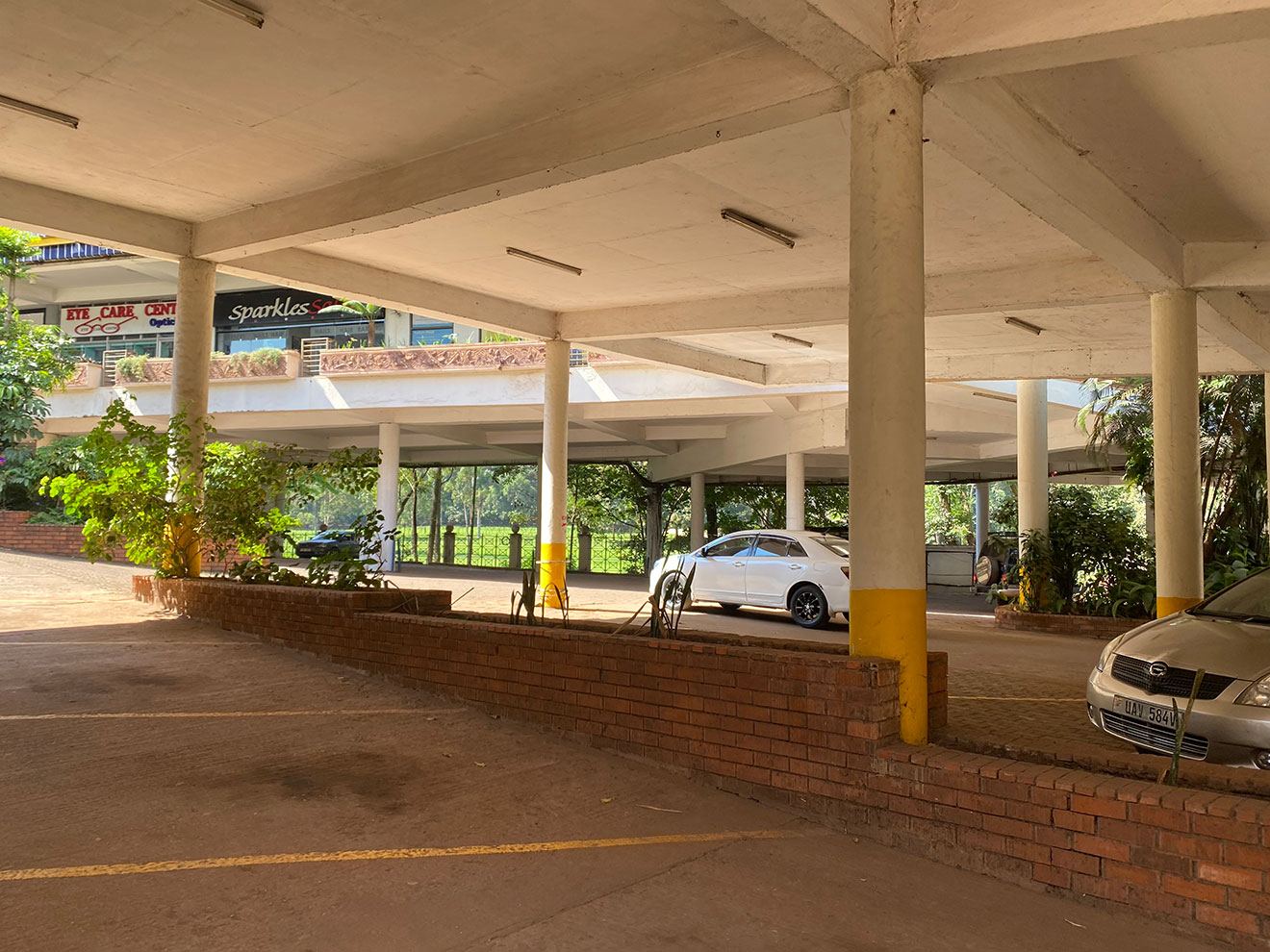 The vast and quiet basement parking at Garden City Mall, in the heart of Kampala (2025).